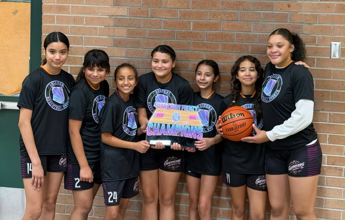 Guerreras team holding the Champions trophy